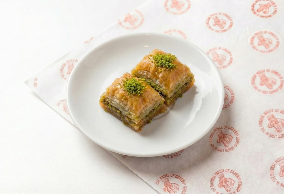 Baklava, two pieces of layered pistachio pastry