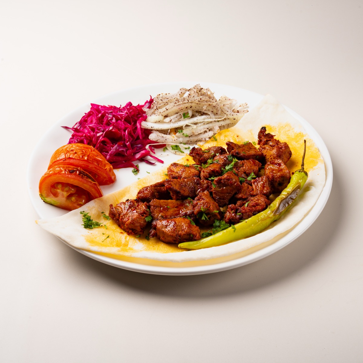 Lamb shish kebab cubes grilled over flame