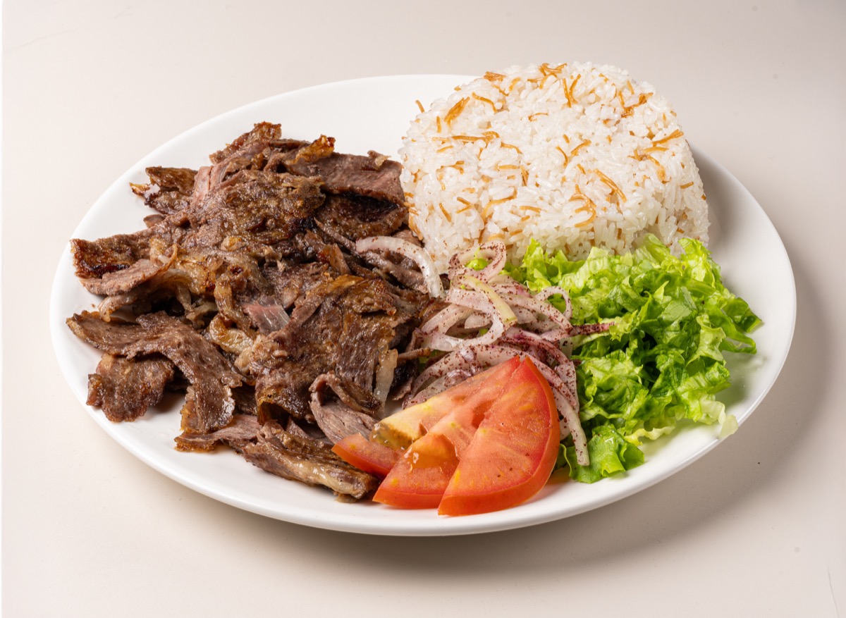 Beef döner served over buttery Turkish rice with salad