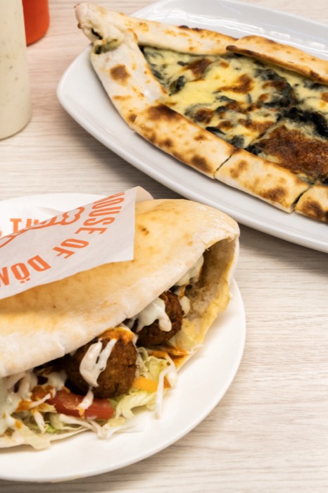Falafel pita and spinach pide on the table