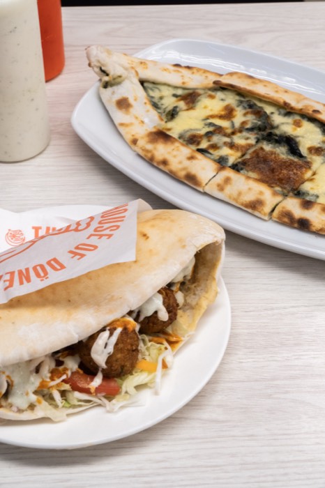 Falafel pita and Turkish pide on the table
