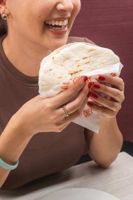 Guest enjoying a House of Döner wrap