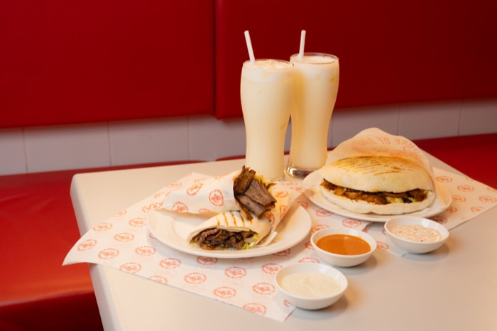 Ayran drinks and döner plates on the table