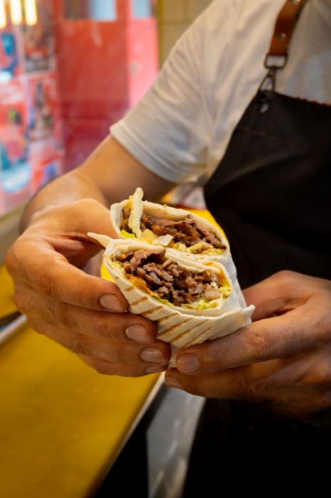 Beef döner wrap held open