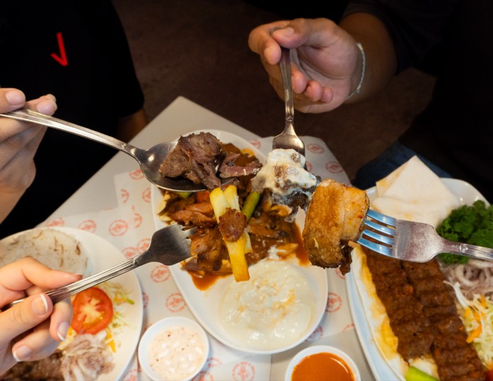 Friends sharing a grill platter
